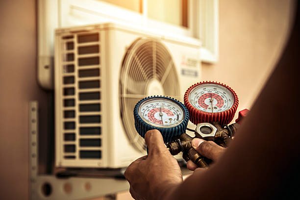 Professional Air Conditioning Service technician working in Medfield, MA